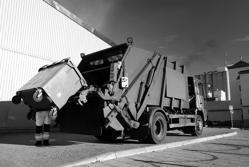 Professional team clearing out a cluttered garage in Harrow