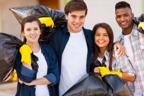 Efficient clearance workers sorting items for donation and recycling in Harrow